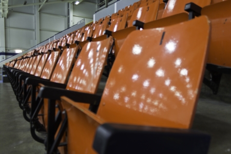 Empty spectator seats in a stadium arenaの写真素材