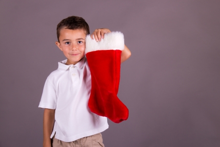 Boy and his Christmas stockingの写真素材