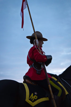 OTTAWA, CANADA - JUNE 27, 2013  The Royal Canadian Mounted Police  RCMP  Musical Ride performs during its Sunset Ceremonies series in Ottawa, Canada on June 27, 2013 のeditorial素材