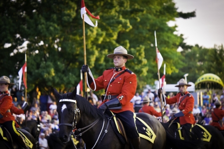 OTTAWA, CANADA - JUNE 27, 2013  The Royal Canadian Mounted Police  RCMP  Musical Ride performs during its Sunset Ceremonies series in Ottawa, Canada on June 27, 2013 のeditorial素材