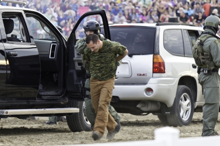 OTTAWA, CANADA - JUNE 27, 2013  Members of the Royal Canadian Mounted Police  RCMP  Tactical Team perform a demonstration during the Sunset Ceremonies series in Ottawa, Canada on June 27, 2013 のeditorial素材