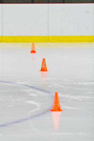 Pylons on the ice in an arenaの写真素材