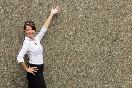 Young attractive business woman gesturing with arms - copy spaceの写真素材