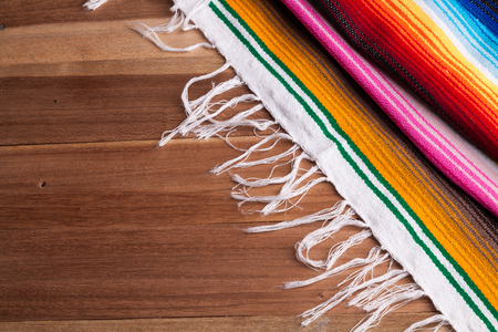 Traditional colorful Mexican serape on a tableの写真素材