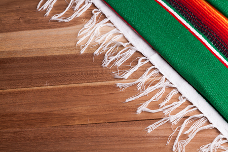 Traditional colorful Mexican serape on a tableの写真素材