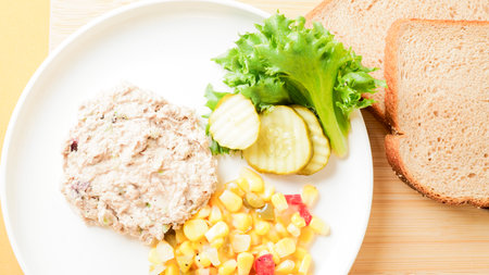 Tuna salad with bread and vegetable on plate - Healthy food styleの写真素材