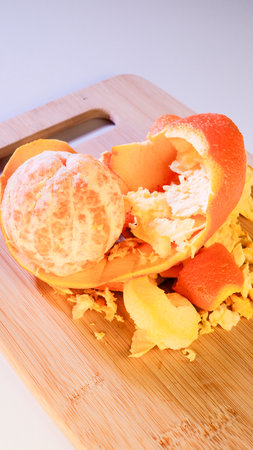 orange peel on a wooden board, closeupの写真素材