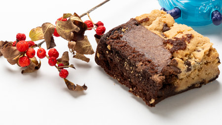 Chocolate cake with berries on a white background, close-upの写真素材