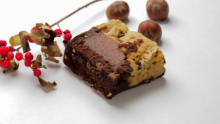 Chocolate cake with nuts on a white background. Selective focus.の写真素材