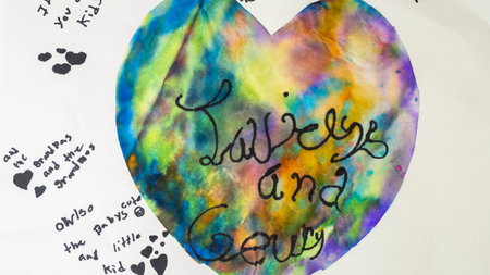 I love you so much, hand lettering on colorful heart backgroundの写真素材