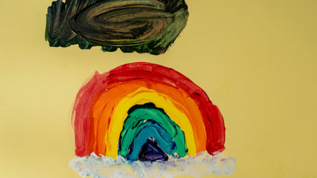 Rainbow painted on a yellow background. Hand-drawn illustration.の写真素材