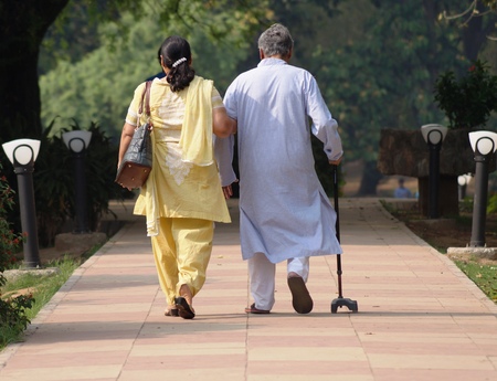An Old Couple Walking in a Gardenの写真素材