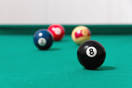 Billiard balls on green pool