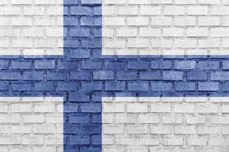 Finland flag on a brick wallの写真素材