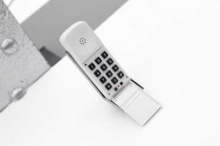 White classic telephone on white table