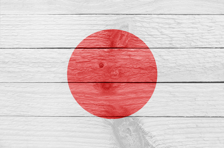 Japanese flag on a wooden plankの写真素材