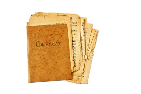 Old sheet of concert music in murky folder isolated on white の写真素材