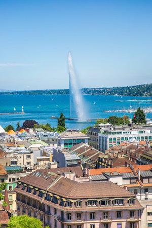 City view and Jet d'Eau fountain on Lake Geneva. Taken from St. Peter's Cathedral, Switzerland. The...