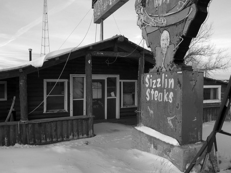 An abandoned Inn along the highway in Wyoming during Winter.の写真素材