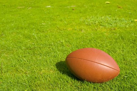 Football on Field of Grass