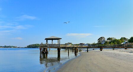 Early morning at the south end of Tybee Island beach. A view of the Tybee Creek side of the islandの写真素材