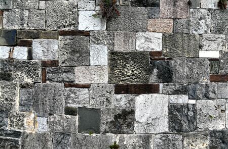 Close-up of a stone wall near River Street in Savannah, Georgiaの写真素材