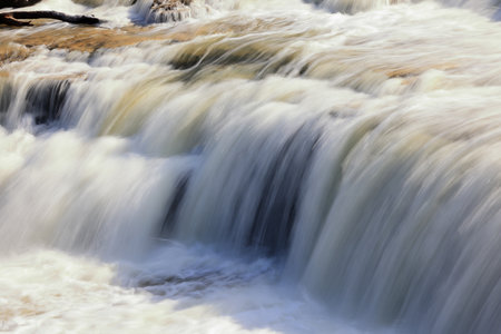 Waterfall in the forest, close-up, soft focus.の写真素材