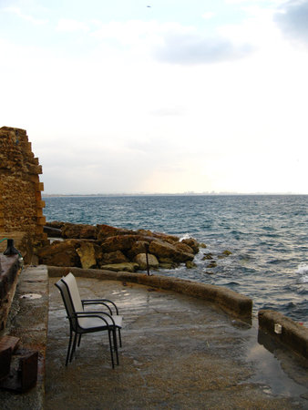 Lawn chairs on the Mediterranean Seaの写真素材