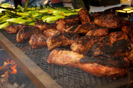 Large Party size Barbegue Beef and corn blazing over a wood burning BBQ.の写真素材