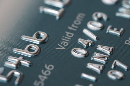 Credit card numbers shot close up showing the words Valid From and the date.