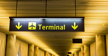 Airport sign with directions to terminal buildingの写真素材