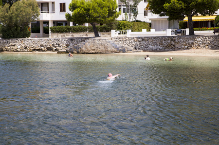 Man swimming in open sea in Mallorcaのeditorial素材