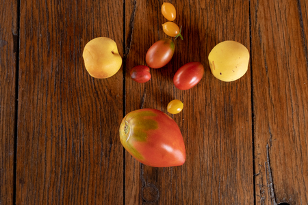 Healthy food based on tomato, cherry anda apple,color red and yellowの写真素材