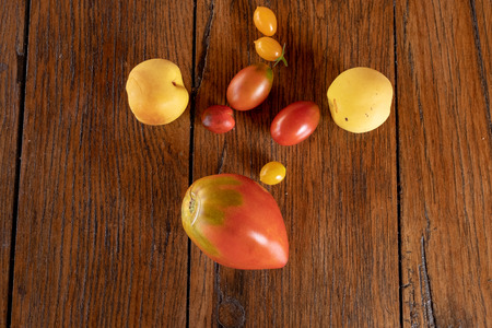 Healthy food based on tomato, cherry anda apple,color red and yellowの写真素材