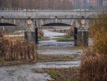 manazanares river, as it passes through the area of ââthe M30 and the former Calderon Stadiumの写真素材