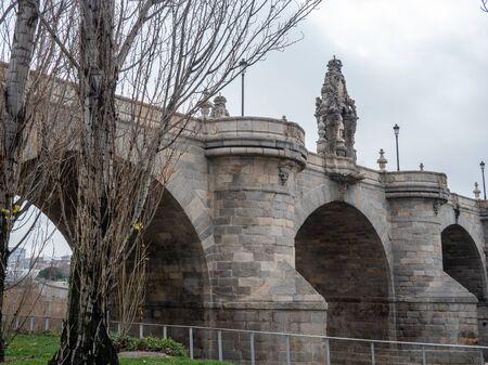 Toledo bridge built in the eighteenth century over the river Manzanares in Madridの写真素材