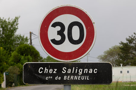 speed limit sign in the town of Chez Salignac Cimune Berneuilの写真素材