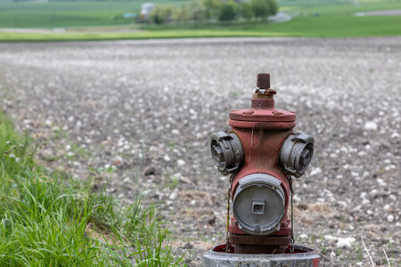 red fire hydrant on the side of the roadの写真素材