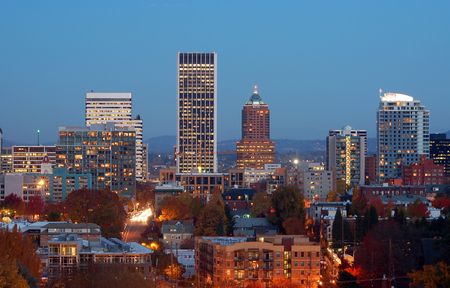 city at dusk with every building has light onの写真素材
