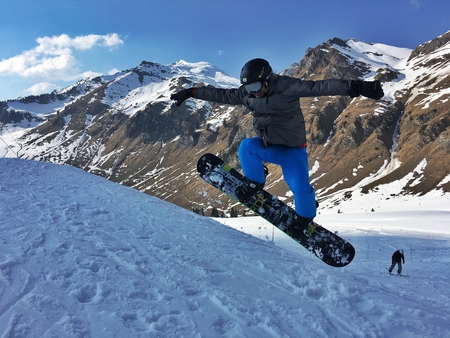 Snowboard jumping in Alpsのeditorial素材