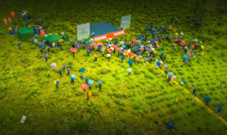 Aerial view of farmers gathering in a field.