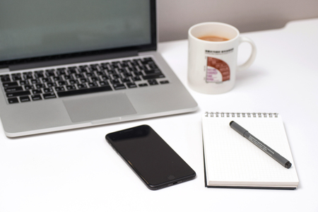 Computer, smart phone, keyboard, pen, coffee, Keyboard, pen, notebook, notepadの写真素材
