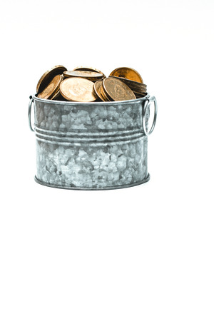 Taiwan Coin stacks and Metal bucket on a white backgroundの写真素材