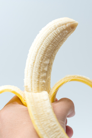 Human Hand Holding Banana Fruit Nutrition Conceptの写真素材
