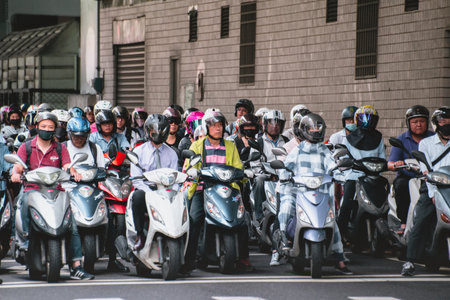 Taipei, Taiwan - July 6, 2018: Motorcycles go down the Taipei bridge during rush hour in the morning.のeditorial素材