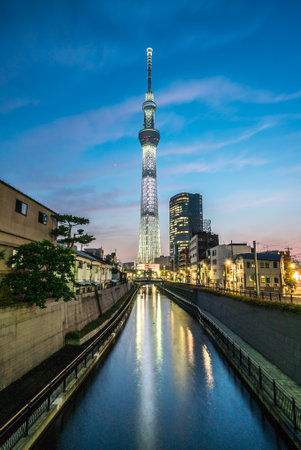TOKYO, JAPAN - June 22, 2018: Tokyo Skytree, Sumida Ward Urban night scene. Tokyo Skytree tower reflections on the canal. Tokyo Sky Tree is one of the famous landmark in Tokyo.のeditorial素材