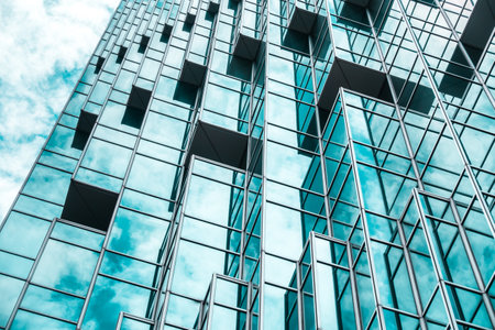underside panoramic and perspective view to steel blue glass high rise building skyscrapers, business concept of successful industrial architectureのeditorial素材