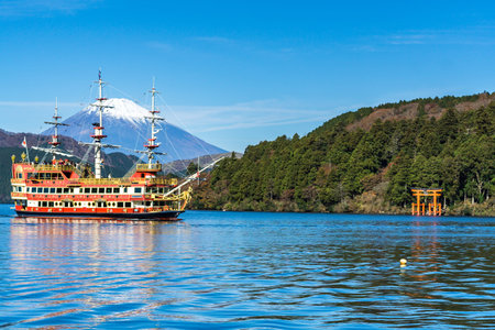 Mountain Fuji and Lake Ashi with sightseeing boat in autumn
