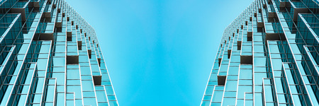 underside panoramic and perspective view to steel blue glass high rise building skyscrapers, business concept of successful industrial architectureの写真素材