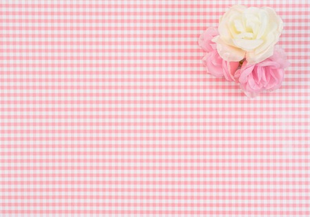 gift box with red isolated on Plaid background. Holiday decoration for Mother's Day or Women's Day.の写真素材